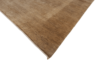 Skymning – Handknuten ullmatta i harmoniska jordtoner - Designmatta.se