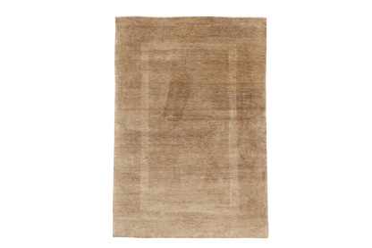 Skymning – Handknuten ullmatta i harmoniska jordtoner - Designmatta.se